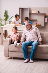 Obraz premium Three generations at home during pandemic