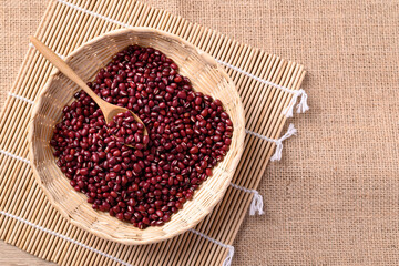 Azuki beans or red mung beans in a spoon and bamboo basket, Food ingredients in many Chinese dishes and filling in Japanese sweet