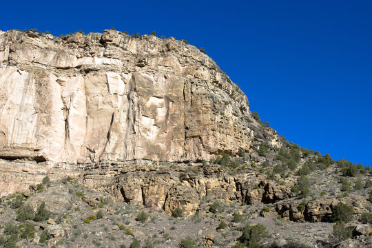 Sheer cliffs rise above Plateau Creek along the scenic byway on Grand Mesa in Colorado