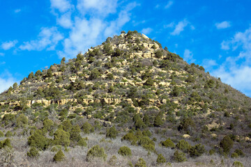Fototapeta na wymiar Rocky peak defines the landscape on the plateau of Mesa Verde National Park