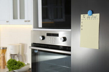 Blank To do list on fridge in kitchen. Space for text