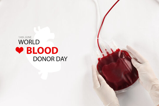 World Donor Day. Doctor in gloves holding blood pack on white background, top view - Powered by Adobe