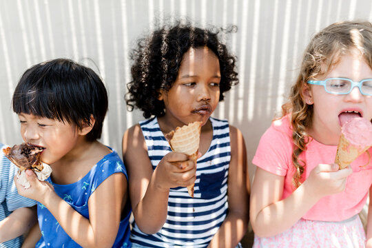 Kids Eating Ice Cream In The Summer