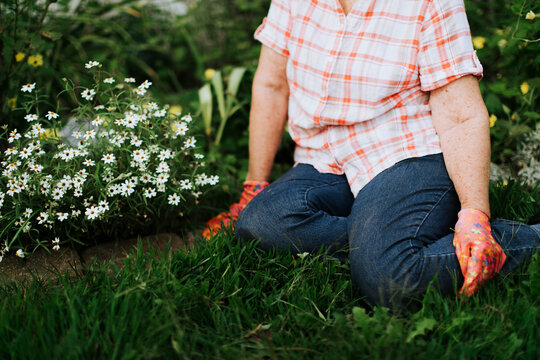 Senior Woman Resting In Her Garden