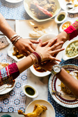 A group of Indian people is having lunch together