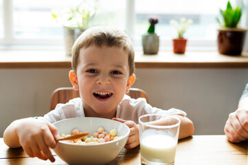 Little boy eating breakfast