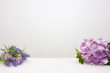 Flowers on the table, white background.