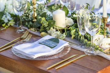 Romantic Wedding Table Top Layout Table Spread no people no human tropical location with gold cutlery and scenic view