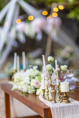 Romantic Wedding Table Top for Two 2 people Layout Table Spread no people tropical beach location with gold cutlery and scenic view of sunset on the beach soft light