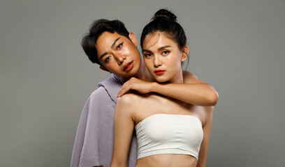 Portrait of 20s Asian LGBTQIA+ Woman and Man hold hug together