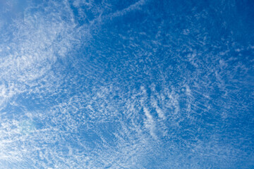 Beautiful blue sky background, white clouds covering thinly spread the sky
