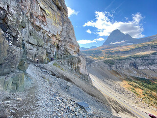 Narrow hiking trail on rock butters in Glacier National Park