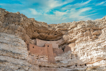 Close-up view of Montezuma castle  National Monument, blue sky ancient cliff dwelling in Camp Verde Arizona by the indigenous Sinagua people, early stone-and-mortar masonry, constructed from limestone