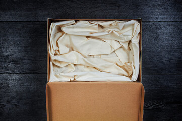 Box with stuff inside for a pet or gift.Sleeping place for pet.Eco-friendly pet sleeping area made from recycled waste