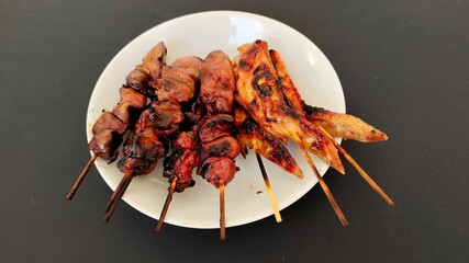 Grilled chicken on a plate.