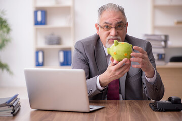 Fototapeta premium Old male employee in retirement concept