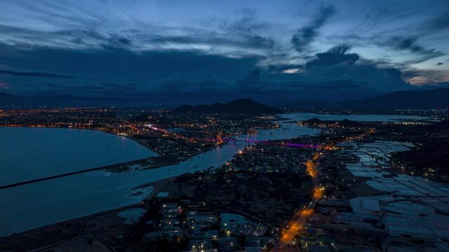 Blue hour hyperlapse above coastal town Phan Rang in Vietnam, aerial