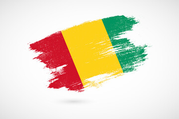 Happy independence day of Guinea with vintage style brush flag background