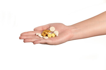 Pills in hand isolated on white background.