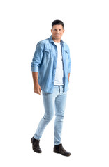 Fototapeta premium Fashionable young man on white background