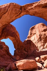 double arch red  rock formation on a sunny day in arches national park, near moab, utah