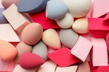 Heap of makeup sponges as background