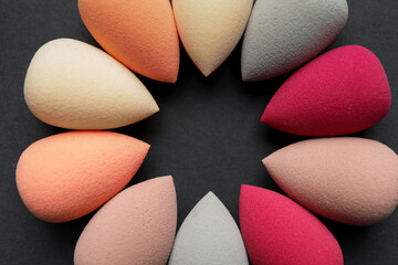 Makeup sponges on dark background