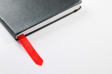 Book with bookmark on white background