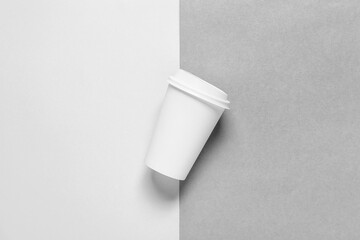 Blank paper cup on grey background
