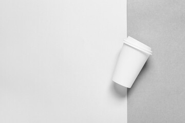 Blank paper cup on grey background