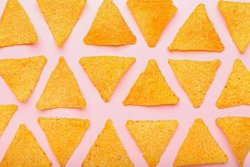 Tasty nachos on color background