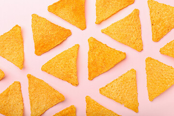 Tasty nachos on color background