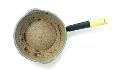 Top view small modern saucepan with burning mark on the surface, modern pan with black handle, the image on white background.