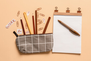 Pencil case and stationery on color background