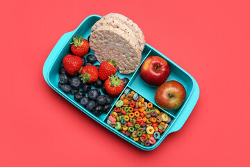 Lunchbox with tasty food on color background