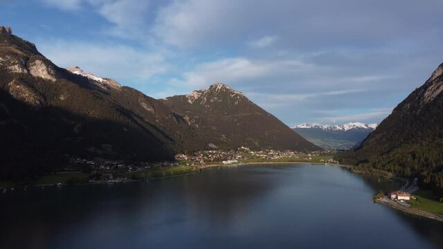 Achen lake and Alps, Maurach village aerial timelapse close to the sunset and golden hour.