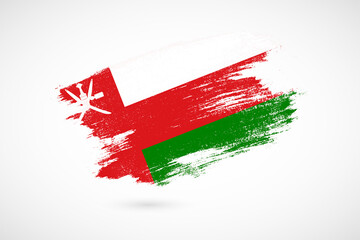 Happy independence day of Oman with vintage style brush flag background