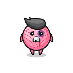 injured yarn ball character with a bruised face