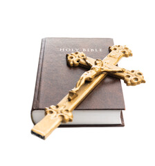 The holy bible and crucifix isolated on white  background.