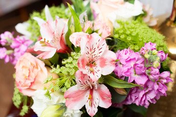 A view of a floral bouquet, featuring lily of the incas flowers.