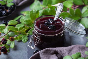 Homemade blackberry jam or confiture, cooking, preserving at home