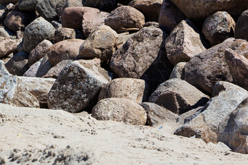 Rockfall on the road in the mountains. Stones of different sizes. Landslides.