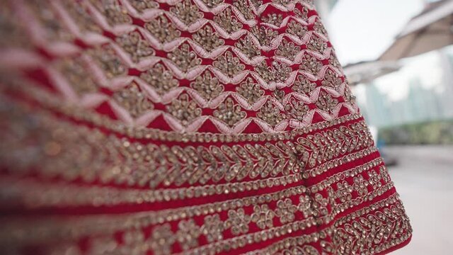 Designer Skirt for women suitable for wedding. Extreme close up shot of Bride&rsquo;s dress at Indian marriage ceremony. 