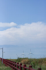 brown fence and sky with white clouds