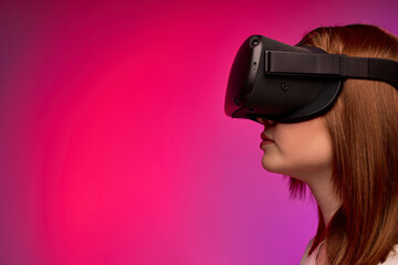 Side View Portrait Of Woman In VR Glasses Goggles, Looking At Side, Concentarted On Video Game, Alone. Close-up Photo Of Young Lade Engaged In VR Virtual Reality