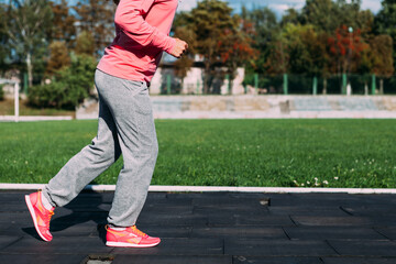 young woman doing exercises in the park