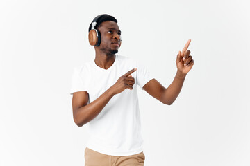 Fototapeta premium African American in headphones music gestures with hands emotions