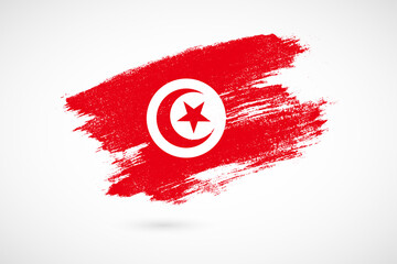 Happy independence day of Tunisia with vintage style brush flag background