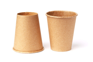 paper cup made of ecological materials, one is standing the other upside down, isolated on a white