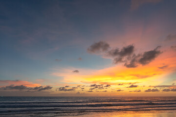 Fototapeta na wymiar Majestic sunset or sunrise landscape Amazing light of nature cloudscape sky and Clouds moving away rolling .Beautiful Phuket beach is a famous tourist destination in Andaman sea summer. 